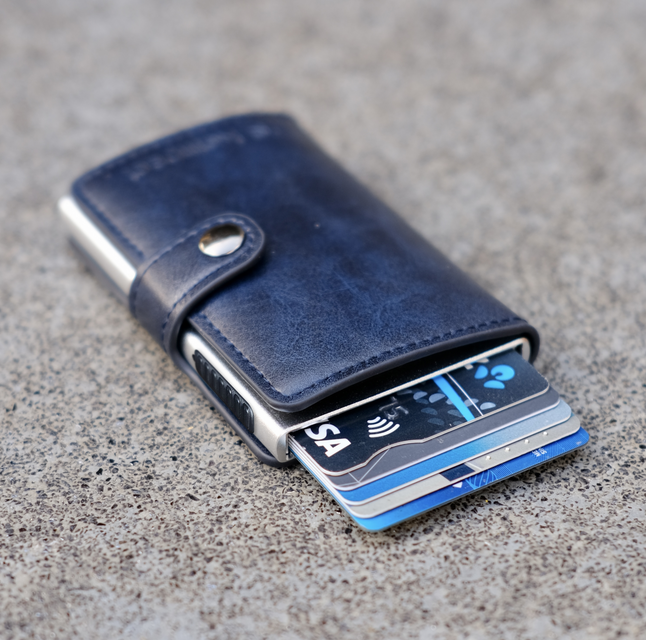 Kompact Cobalt (Navy) wallet on stone bench